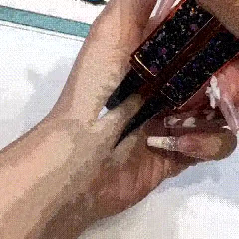 Applying eyeliner
